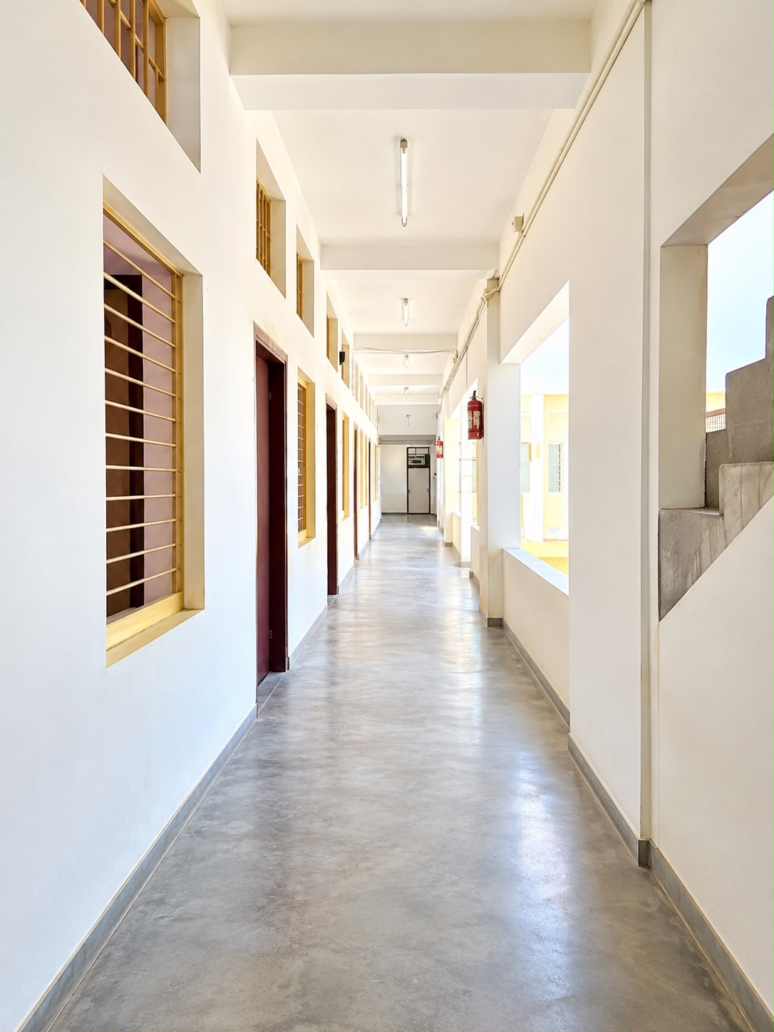 Clean airy school corridor connecting classrooms