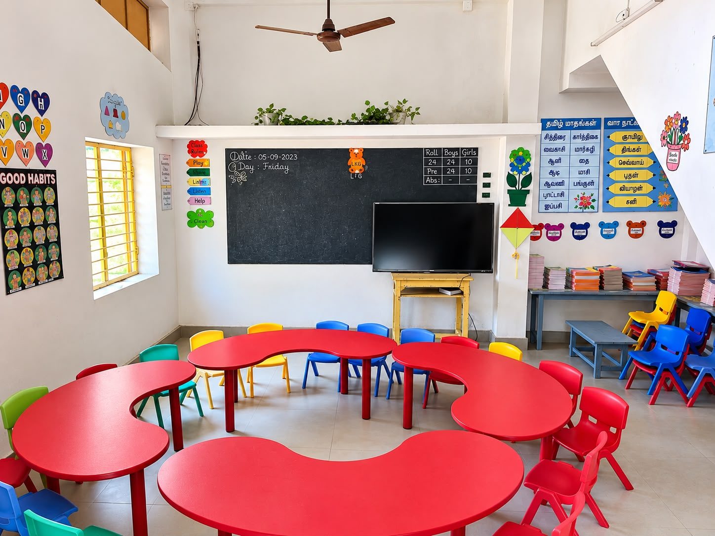 Kindergarten activity room with round tables and tiny chairs